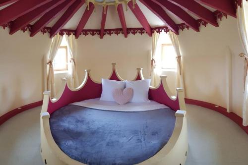 a bedroom with a bed in a tent at Beautiful Château with Private Pool near Cahors in Cambayrac