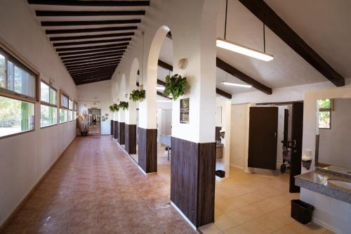 an empty hallway in a building with a long corridor at Kampaoh Mendigorría in Mendigorría