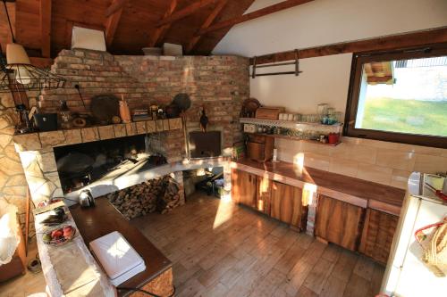 an overhead view of a living room with a fireplace at Idyllic river front holiday houses - Tišine in Goražde