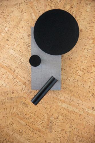 a piece of paper with a black top on a wooden floor at Greet Hotel Colmar in Colmar