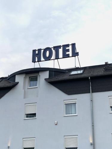 a hotel sign on top of a building at Ibis Styles Charleroi Airport Aero 44 in Charleroi