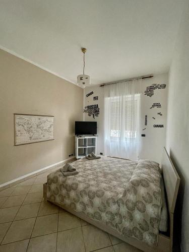 Un pat sau paturi într-o cameră la L'anima del viaggio a Torino