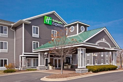 a front view of a hilton express hotel at Holiday Inn Express Grand Rapids Southwest by IHG in Grandville
