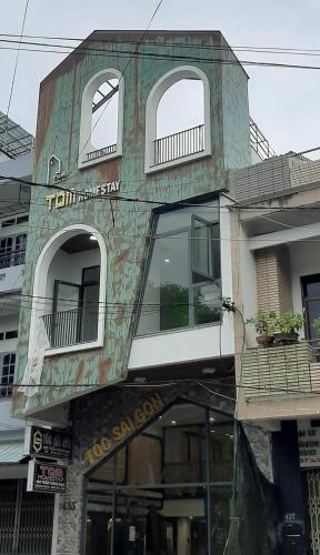 a building with a building with windows at Tom Homestay Quy Nhơn in Quy Nhon