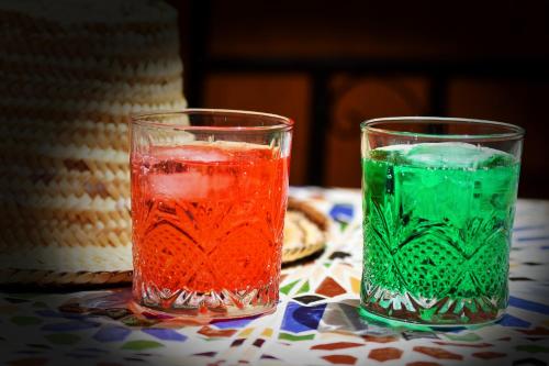 two glasses sitting on top of a table at Riad Parfums de OUARZAZATE in Ouarzazate
