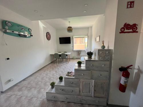 a living room with a dresser and a tv at Casa Vacanze Carmelita Centro-Stazione in Bracciano