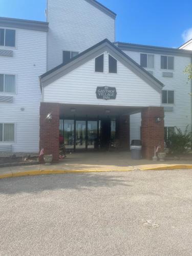 a building with a sign on the front of it at Gasthof Amish Village INN in Montgomery