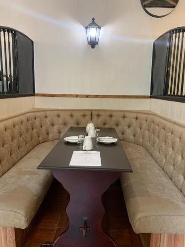 a table in a booth in a restaurant at Fairburn Activity Centre in Contin