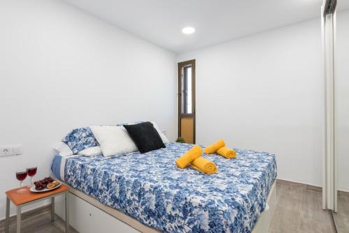 a bedroom with a bed with a teddy bear on it at Best Holiday Fanabe in Adeje