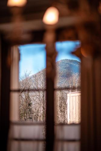 a view of a window with two vases at Hotel Mas de Xaxas in Camprodon