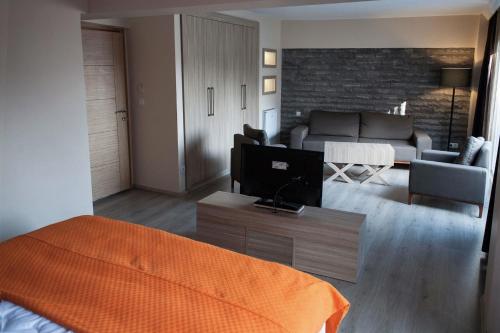 a living room with a bed and a couch at Sun Suites in Istanbul