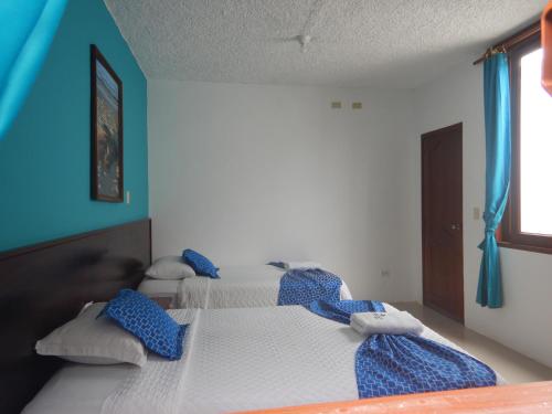 Postel nebo postele na pokoji v ubytování Hotel LA GRAN TORTUGA - ᯤ STARLINK