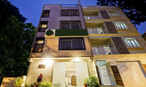 a tall building with lights in front of it at Treebo Elite Premium Homes in Bengaluru