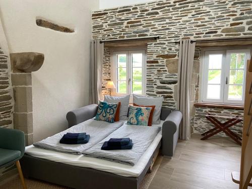 Cama o camas de una habitación en Domaine de Kerdavid - Chambres d'hôtes à Remungol