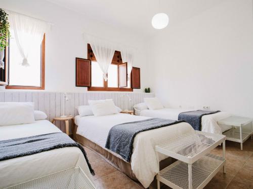 Postel nebo postele na pokoji v ubytování Apartamentos El Marinero - Casa Juana