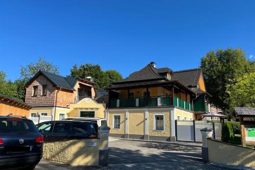 a house with a car parked in front of it at Im Kurpark in Bad Ischl