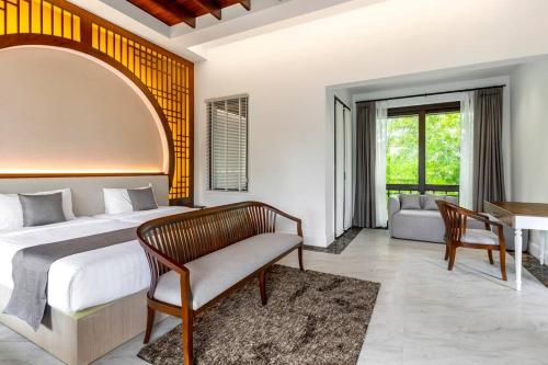 a bedroom with a bed and a couch and a desk at Sclass 2 Luxe Pools Villa & Breakfast , city area in Chiang Mai