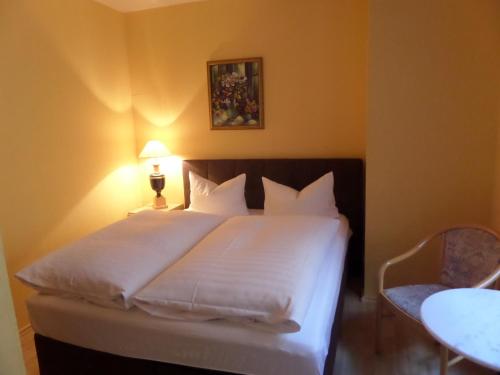 Ένα ή περισσότερα κρεβάτια σε δωμάτιο στο Hotel Sudenburger Hof