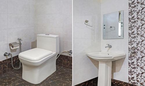 a bathroom with a toilet and a sink at Hotel Albie Stay Inn in Manī Mājra