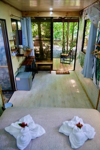 a bedroom with a bed with towels on it at TERMINAL VERDE PRIVATE APARTMENTS NEAR AIRPORT 24h SELF CHECK IN in Concepción