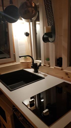 a kitchen counter with a sink and a window at Amarok in Muhlbach-sur-Munster
