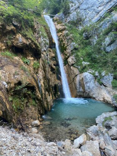 a waterfall in a canyon with a pool of water at Appartement Rosa in Patergassen