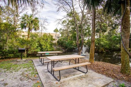 two picnic tables and a grill in a park at Xanadu in Hilton Head Island
