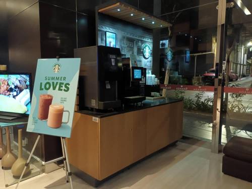 a store with a sign that says summer loves at City Home Suites Kuala Lumpur City Centre in Kuala Lumpur