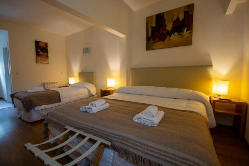 Postel nebo postele na pokoji v ubytování NBH Nativo Boutique Hotel