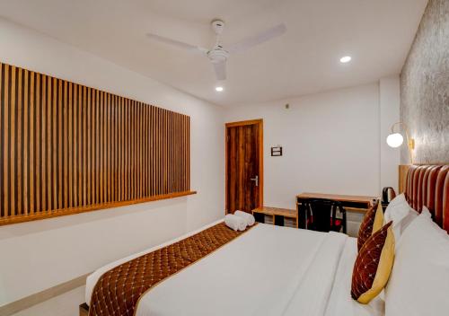 Ein Bett oder Betten in einem Zimmer der Unterkunft Hotel Sai Rain Tree
