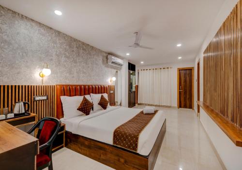 Ein Bett oder Betten in einem Zimmer der Unterkunft Hotel Sai Rain Tree