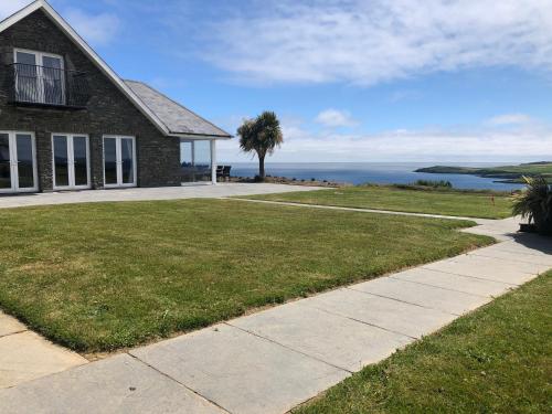 a house with a view of the ocean at Ocean View,Kinsale, Exquisite holiday homes, sleeps 22 in Kinsale