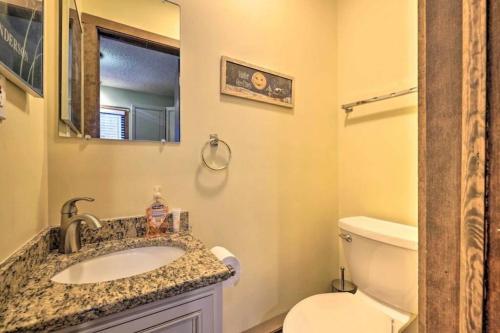 a bathroom with a sink and a toilet and a mirror at Ian's Camelback House in Tannersville