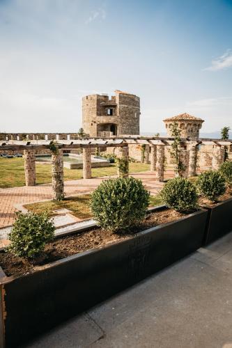 a view of a castle with bushes in front of it at Castello di Rocca Cilento in Rocca Cilento