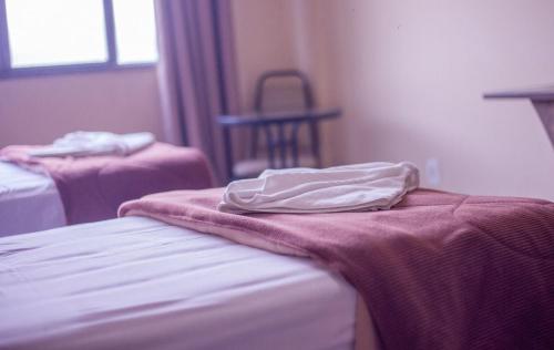 Postel nebo postele na pokoji v ubytování Hotel Ermitage