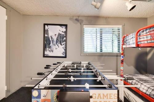 a game room with a large table in the middle at Garrett's Camelback House in Tannersville
