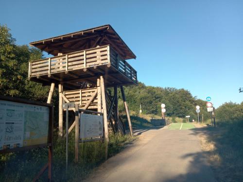 a wooden bridge on the side of a road at Markowa Chata in Cisna