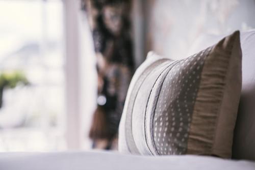a close up of a pillow on a bed at Bedford Hotel in Sidmouth