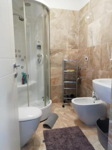 a bathroom with a shower and a toilet and a sink at NEL CUORE DI PADOVA PER 2 - 028060-LOC-01359 in Padova