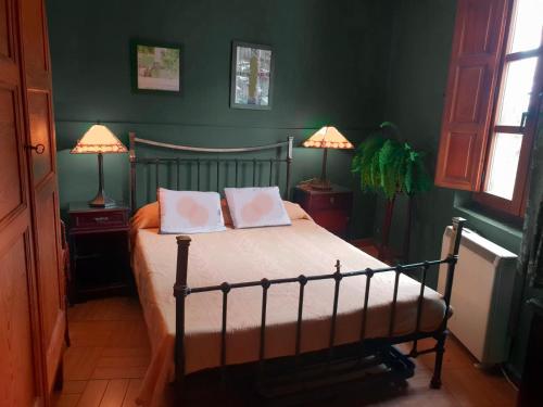מיטה או מיטות בחדר ב-Casa Inma