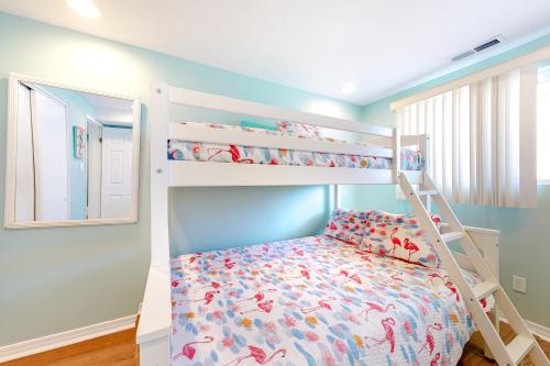 a bedroom with bunk beds in a room with a bed at Waves 307 in Ocean City