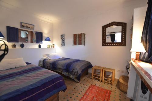 Кровать или кровати в номере Superbe appartement traditionnel - Medina