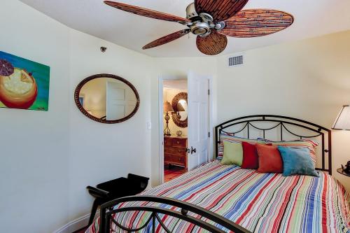 a bedroom with a bed with a ceiling fan at Wellington 304 in Myrtle Beach