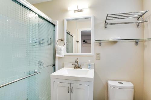 a bathroom with a sink and a shower and a toilet at Beacon Hill Hideaway in Seattle