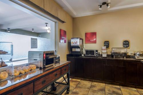 a kitchen with a large counter top and a large counter top at Best Western Plus Kamloops Hotel in Kamloops