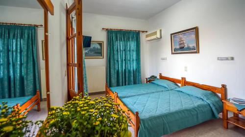 Postel nebo postele na pokoji v ubytování Effie Hotel