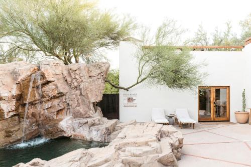 a rock waterfall in front of a building at The JTH Tucson in Tucson