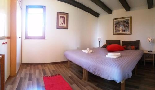 a bedroom with a large bed in a room at Secluded holiday house Forcici, Central Istria - Sredisnja Istra - 12233 in Roč