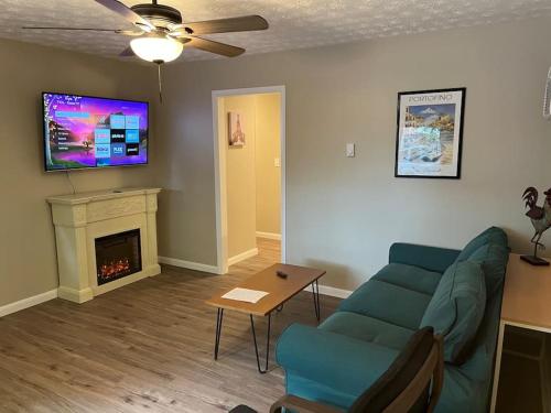 a living room with a couch and a fireplace at Carter #6 Two Bedroom Apartment near Xavier in Cincinnati