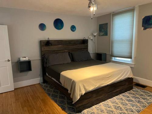 a bedroom with a large bed in a room at Main, Three Bedroom House in Historic Loveland in Loveland
